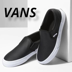 leather slip on vans all black